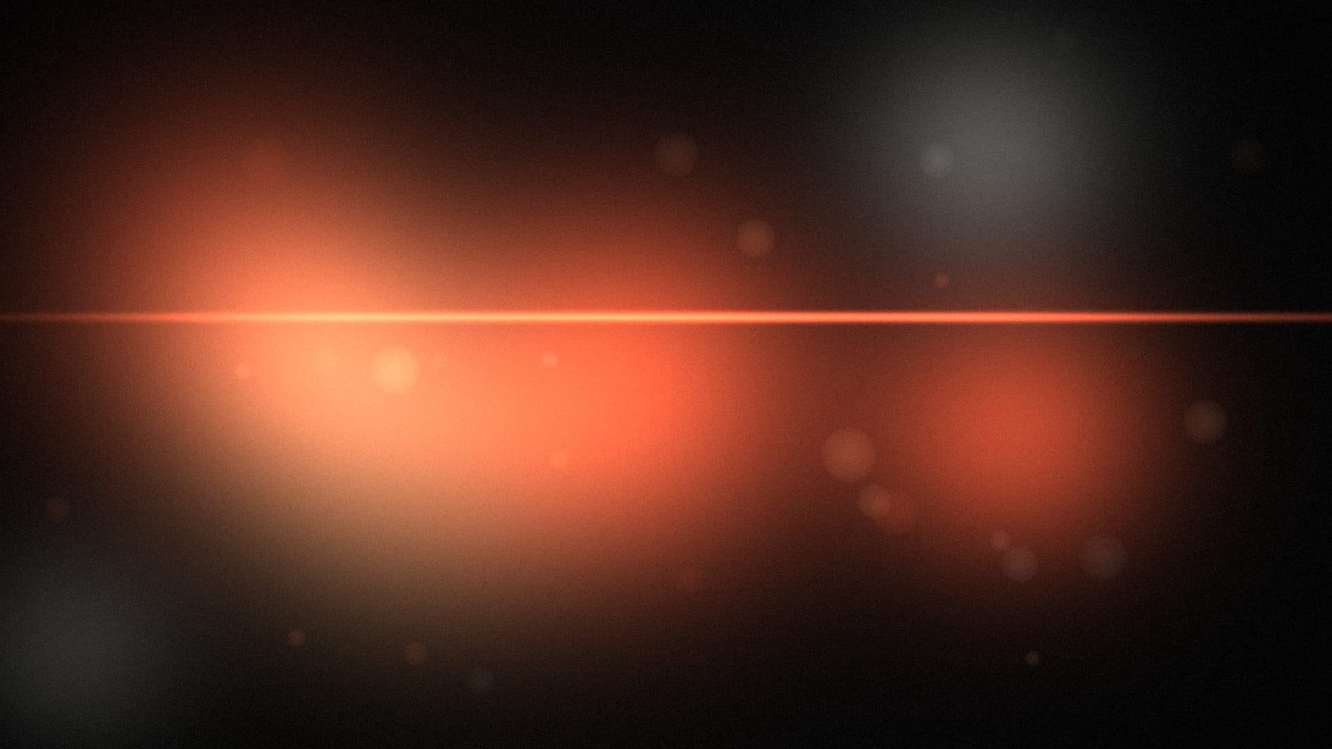 Abstract placeholder of warm out-of-focus light with an anamorphic lens flare